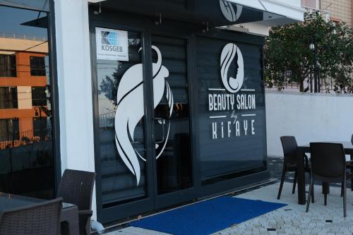 a front door of a restaurant with a sign on it at Şahin Tepesi Suite Otel in Trabzon