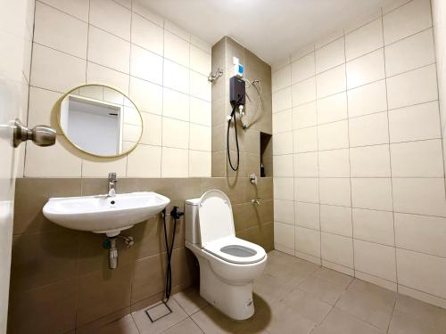 a bathroom with a sink and a toilet and a mirror at Alura Cove Bandar Bukit Raja, Setia Alam in Klang