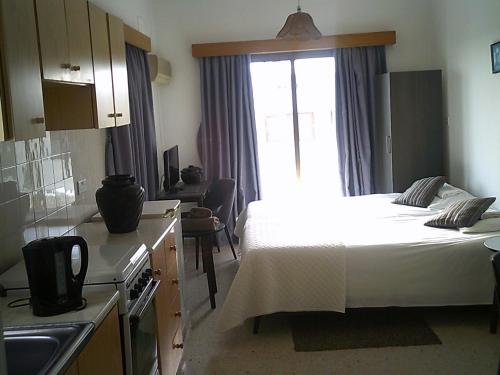 Postel nebo postele na pokoji v ubytování Panklitos Tourist Apartments
