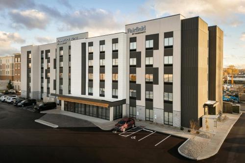 a large building with a parking lot in front of it at Fairfield by Marriott Inn & Suites Cincinnati Oakley in Cincinnati