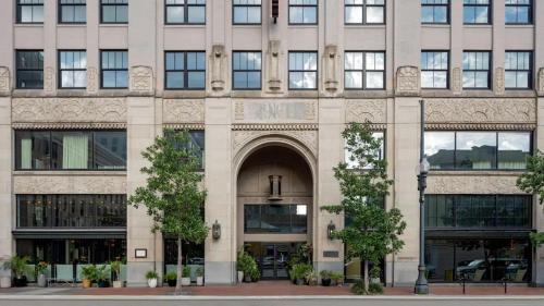 a large building with an archway in front of it at The Barnett, part of JdV by Hyatt in New Orleans