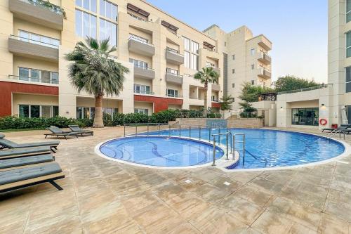 Pool View 1BR in Dubai Free Parking Gym Near Parks and Golf