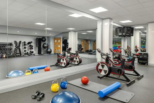 a gym with a bunch of exercise bikes in a room at Glasgow Marriott Hotel in Glasgow
