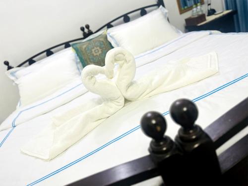 Postel nebo postele na pokoji v ubytování Sea Breeze Guest House Negombo