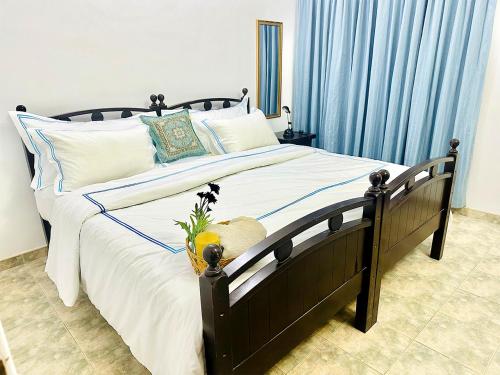 Postel nebo postele na pokoji v ubytování Sea Breeze Guest House Negombo
