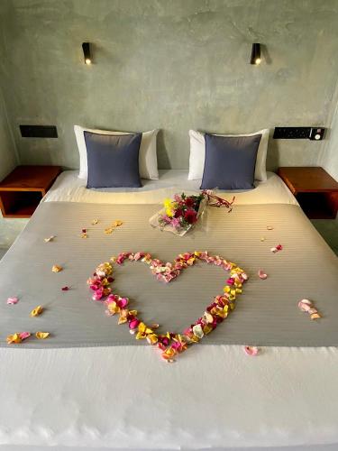 a heart made out of flowers on a bed at Sesatha lake Kandy in Kandy