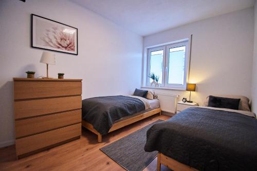 Postel nebo postele na pokoji v ubytování Ferienwohnung FLORA - Meschede