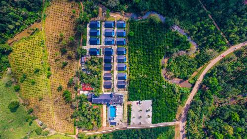 an aerial view of a building in the forest at The Grand Retreat - Chikmagalur in Chikmagalūr