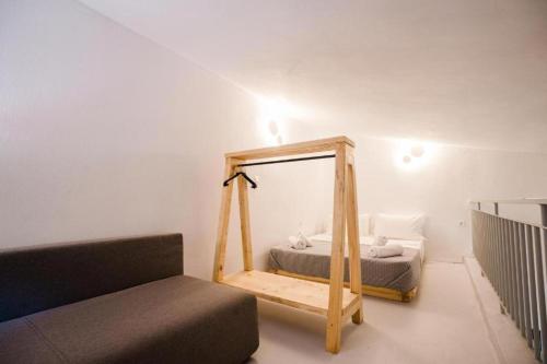 a mirror in a room with a bed and a couch at Reef in Afitos