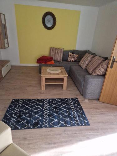 a living room with a couch and a table at Appartment Lidia in Marbach an der Donau