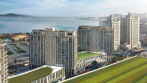 an aerial view of a city with tall buildings at DoubleTree by Hilton Weihai in Weihai