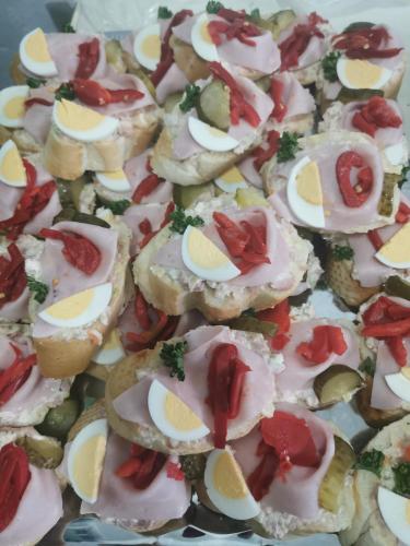 a group of small pizzas with eggs on top at Penzion u Martina in Liberec