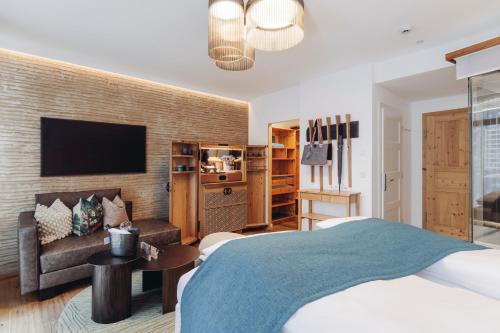 Postel nebo postele na pokoji v ubytování Mooser Hotel