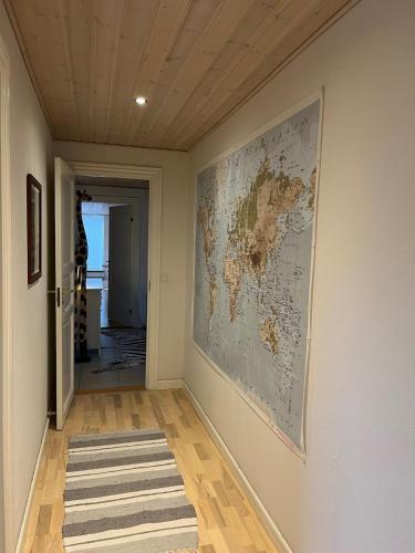 a hallway with a map of the world on the wall at Bright & spacious in Silkeborg in Silkeborg