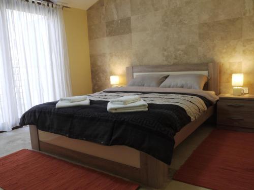 Ένα ή περισσότερα κρεβάτια σε δωμάτιο στο Apartments Residence Portofino