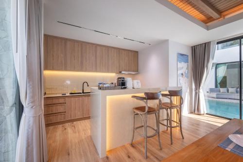Η κουζίνα ή μικρή κουζίνα στο Mövenpick Pool Villa6BR-NEW2025-