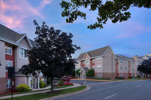 a row of apartment buildings on a street at Residence Inn by Marriott Gaithersburg Washingtonian Center in Gaithersburg