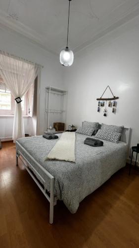 a bedroom with a large bed in a room at The Chill(e) in Lisbon