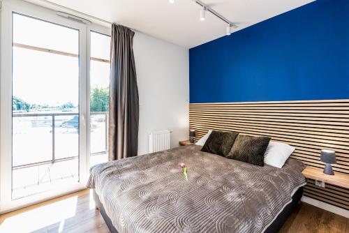 Postel nebo postele na pokoji v ubytování Apartament Lighthouse 06 SurfingBird Mrzeżyno