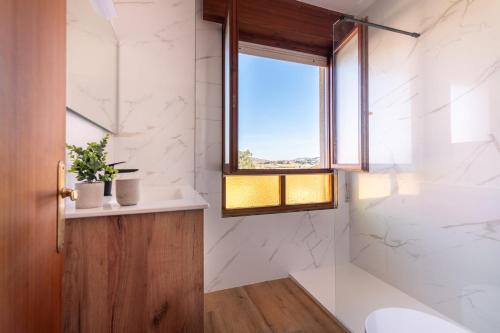 Ένα μπάνιο στο Apartamento la Riberuca con piscina