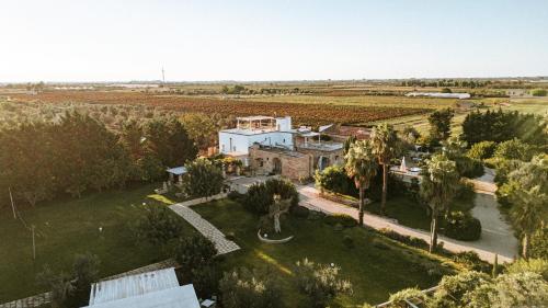 an aerial view of a house in a field at Masseria La Tofala benessere & SPA in Copertino