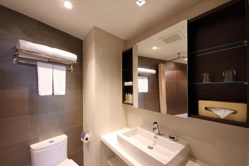 Ванная комната в PARKROYAL Serviced Suites Singapore