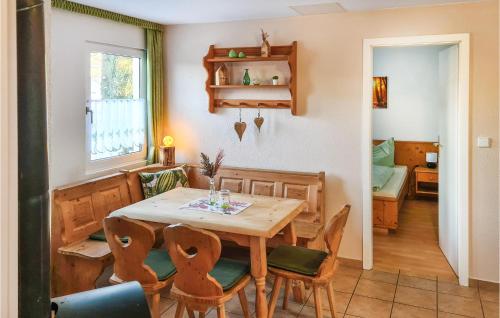 a dining room with a table and chairs at Holiday Home Hauptstrasse B in Eichigt