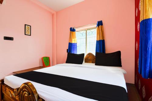 Ένα ή περισσότερα κρεβάτια σε δωμάτιο στο Super Hotel O Sarvodaya Nagar Near Railway Station
