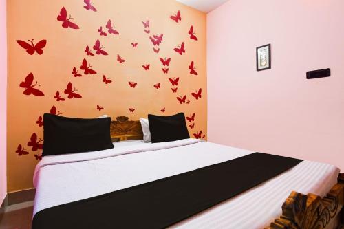 Ένα ή περισσότερα κρεβάτια σε δωμάτιο στο Super Hotel O Sarvodaya Nagar Near Railway Station