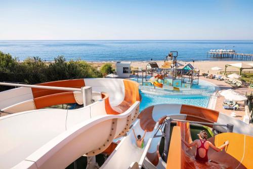 a slide at a resort with the ocean in the background at TUI BLUE Pascha Bay in Konaklı