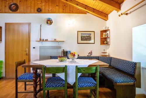 a dining room with a table and chairs at Casa Ai Laresi 2 in Peio