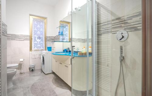 a bathroom with a shower and a sink and a toilet at Lovely Home In Arnasco With Wifi in Arnasco