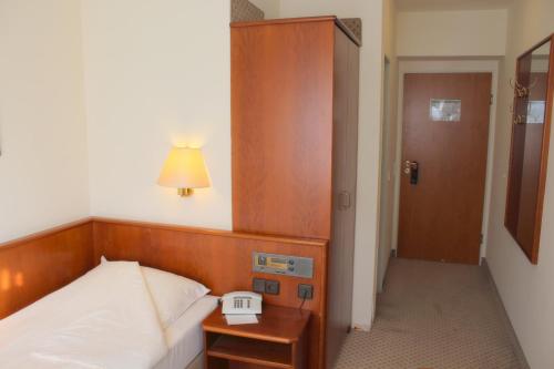 Cama o camas de una habitación en Elbroich Hotel Düsseldorf