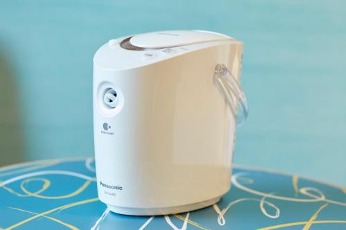 a white toaster sitting on top of a table at The Royal Park Canvas - Osaka Kitahama in Osaka