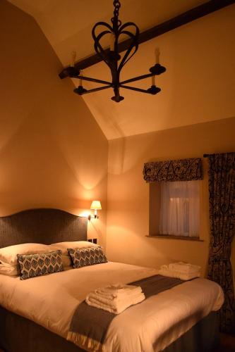 Ένα ή περισσότερα κρεβάτια σε δωμάτιο στο West Acre Lodge