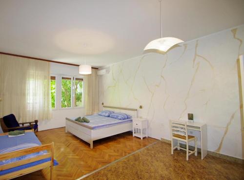 Postel nebo postele na pokoji v ubytování Apartman Gortanova uvala