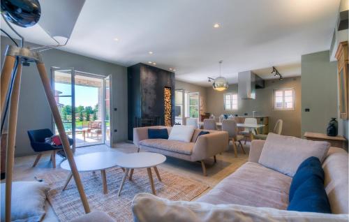a living room with a couch and a table at Villa Mia in Šivati