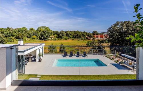 a swimming pool on the balcony of a house at Villa Mia Stella in Štanga