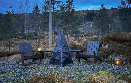 a table and two chairs with a tent over it at 3 Bedroom Amazing Home In Tysse in Tysse
