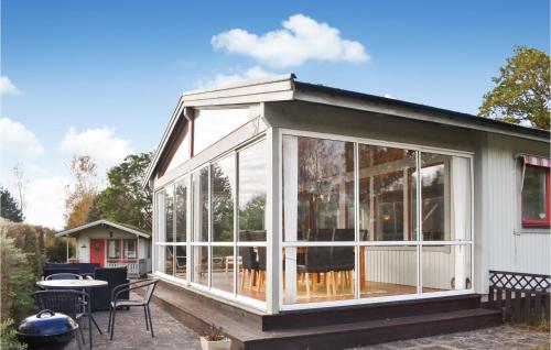 a screened in porch on a house at Holiday Home Tunnbindarvägen Munka-Ljungby in Munka-Ljungby