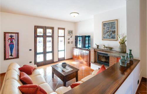 a living room with a couch and a fireplace at Amazing Home In Casciana Terme Lari in Orceto