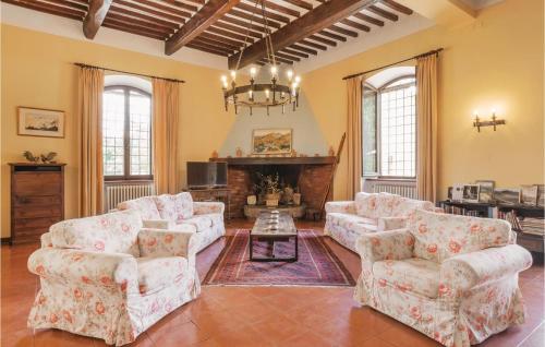a living room with two couches and a fireplace at Rosavita in Chianni