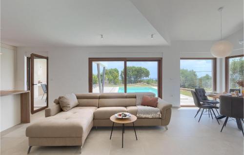 a living room with a couch and a table at Villa Ogradina in Pula