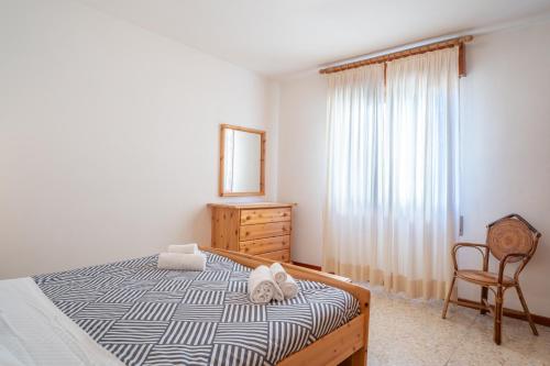 a bedroom with a bed and a dresser and a mirror at Bellavista - Residence in Barzio center near free ski shuttle in Barzio