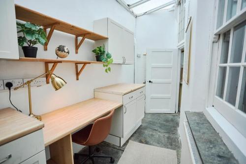 a home office with a desk and a window at Beautiful Town House in Stratton, Bude, Sleeps 8 in Bude