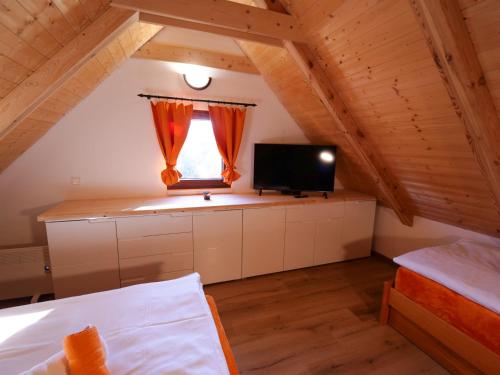 Postel nebo postele na pokoji v ubytování Apartmány 13 Chata