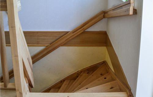 a wooden staircase in a room with wooden stairsafety at 4 Bedroom Lovely Home In Mariefred in Mariefred