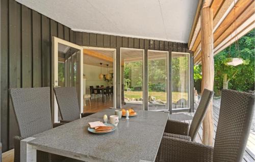 a dining room with a table and chairs at Amazing Home In Glesborg With Wifi in Glesborg