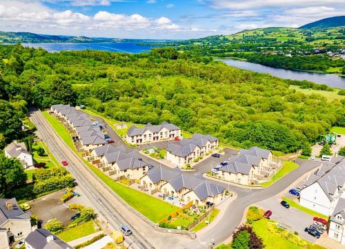 an aerial view of a resort with a river and a road at Boru Walk Townhouse -Stylish & Modern Holiday Home in Killaloe