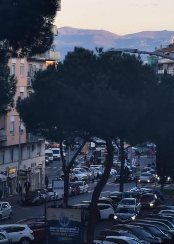 a city street with cars parked in a parking lot at Kea Alloggio Turistico in Rome